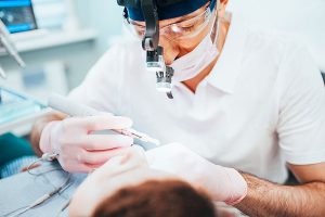 Dentist performing a dental procedure on a patient, emphasizing preventive care and oral hygiene at Trail Ridge Dental.
