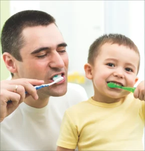 brushing teeth father and son